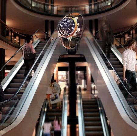 Visualización holográfica en 3D de un reloj en un centro comercial.