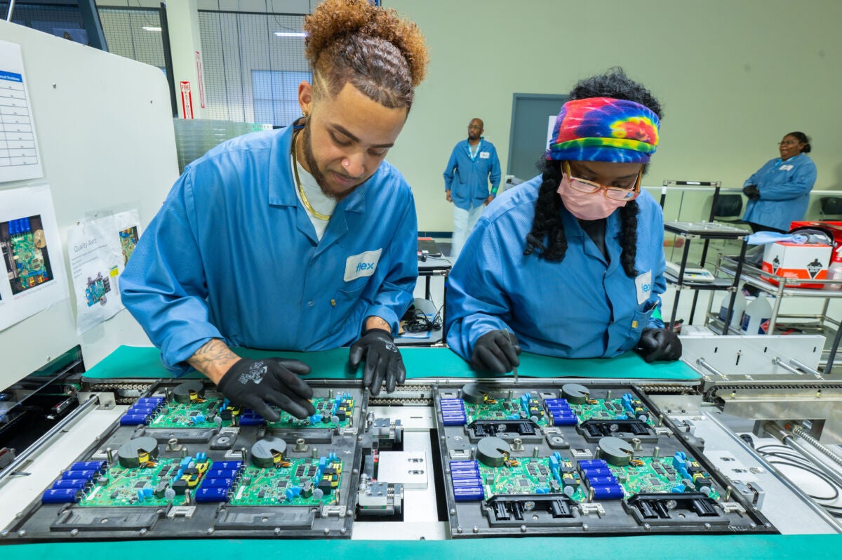 Flex employees on Enphase microinverter production line