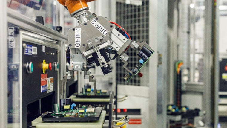 autonomous factory robotic arm on PCBA line