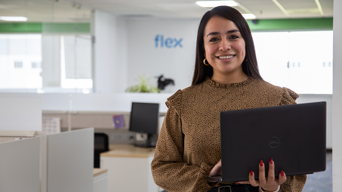 Flex employee holding a laptop