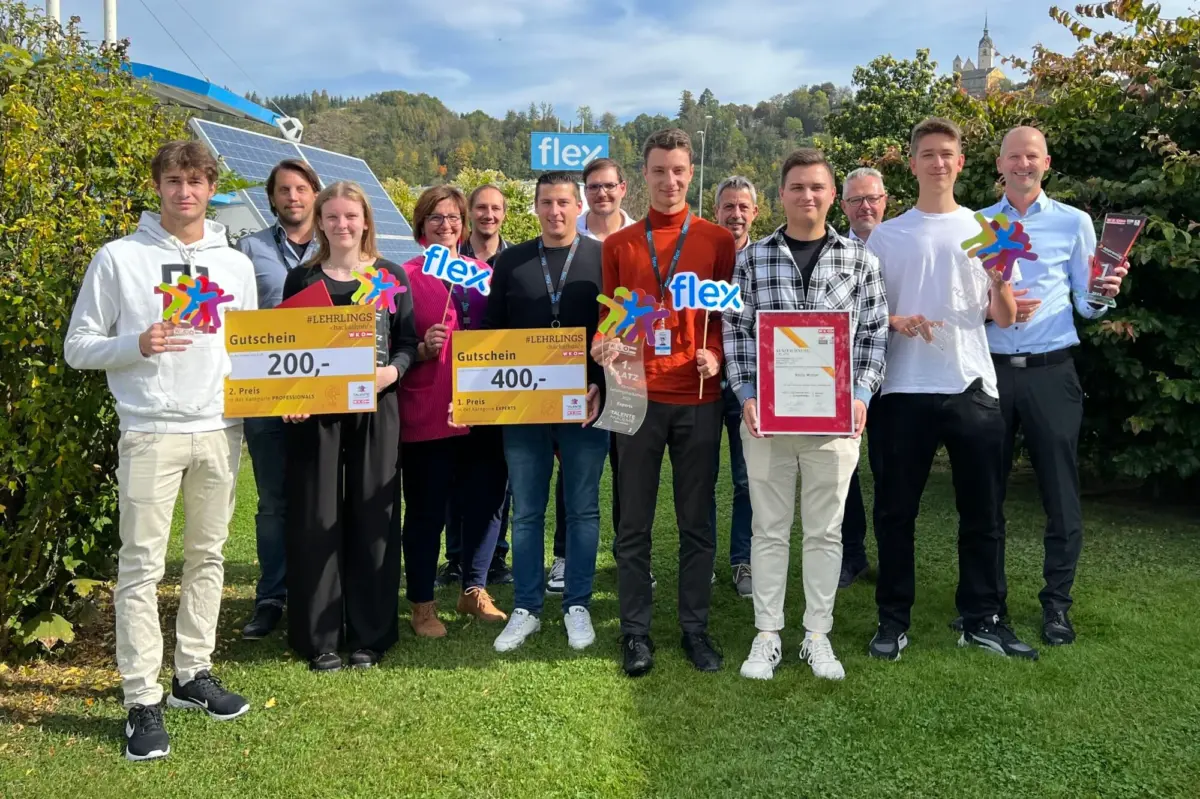 group of flex apprenticeship members hold awards at a hackathon