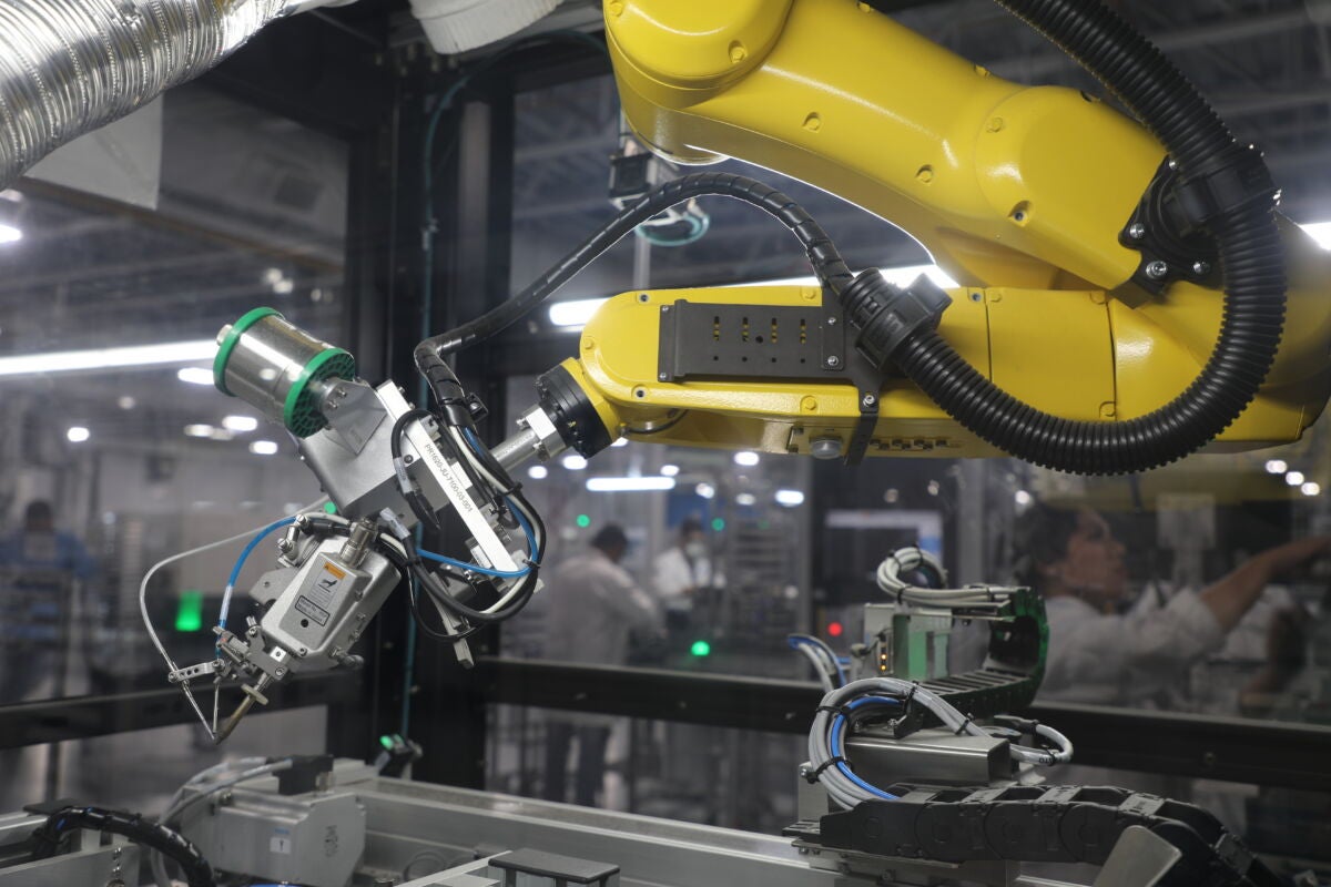 Yellow robotic arm for advanced manufacturing