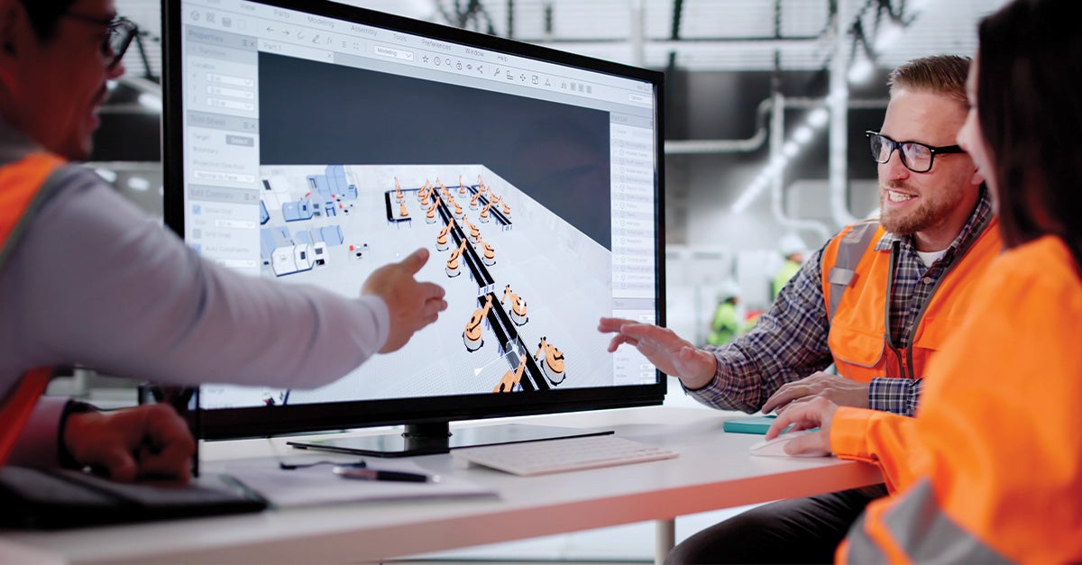 team of engineers collaborating in front of a screen