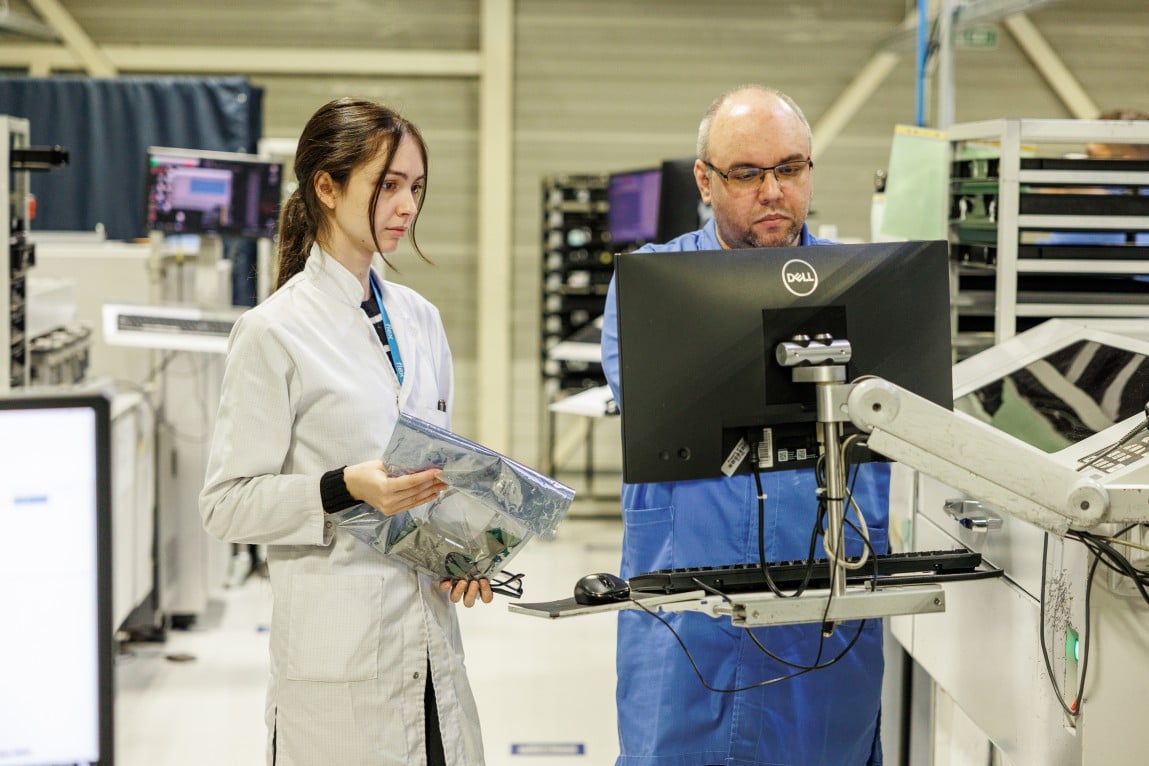 two engineers working together in a factory