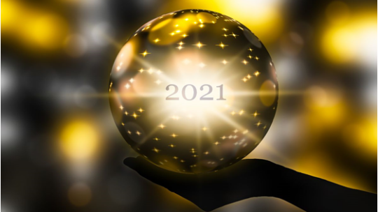 Glowing golden sphere with “2021” at its center resting above a silhouetted hand against a background of bright, shimmering light effects.