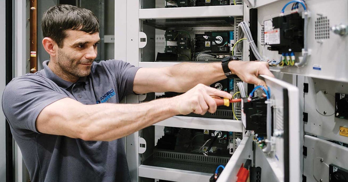 Anord Mardix employee working on a modular power pod