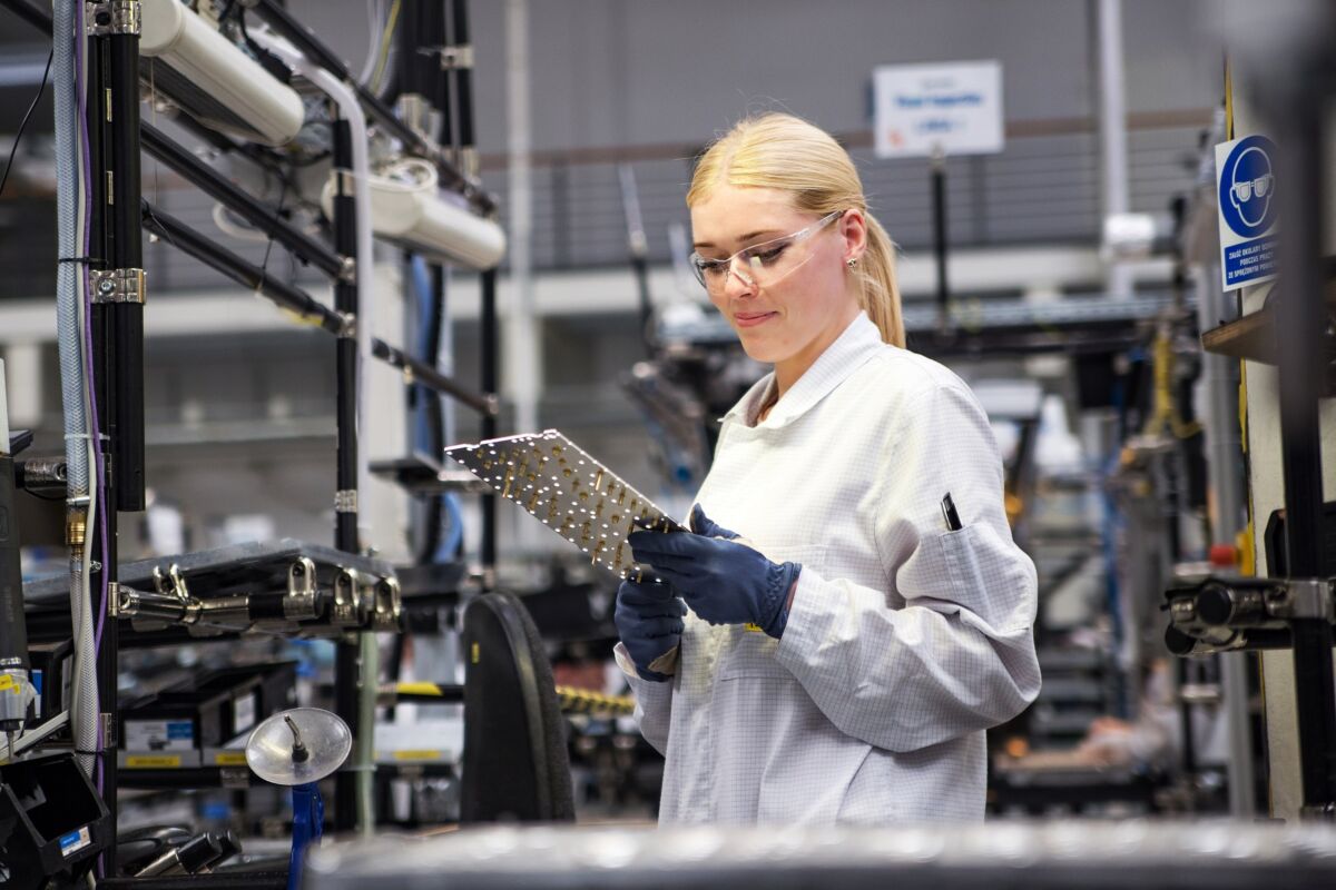 Female working on production line