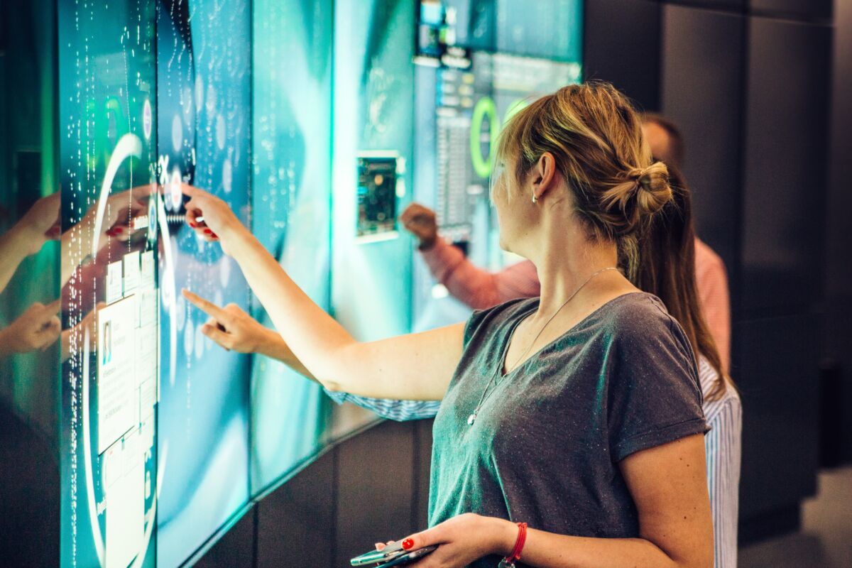 Woman interacting with Flex Pulse screen