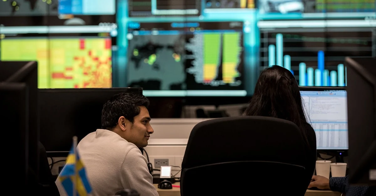 Two people working within the Flex Pulse center for vendor-managed inventory (VMI) solutions