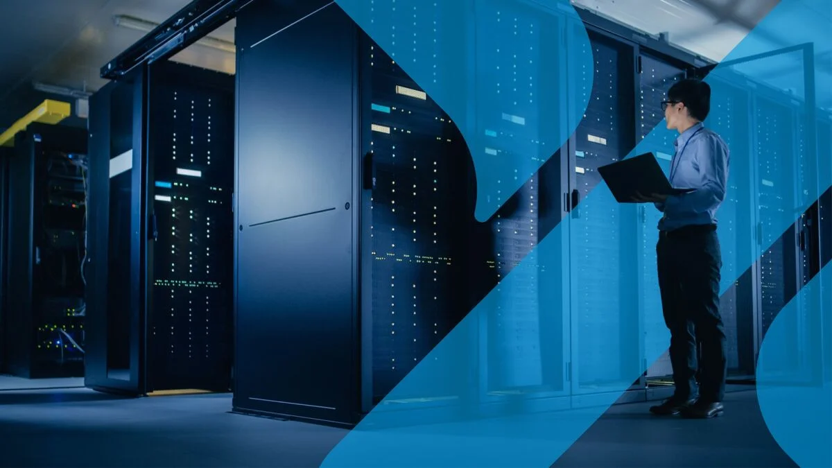 Person monitoring AI data center efficiency with PUE