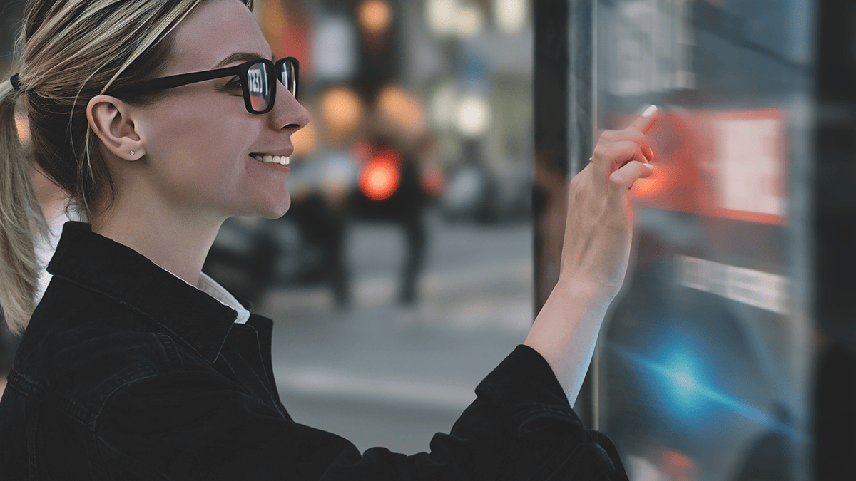 Woman using an interactive retail machine