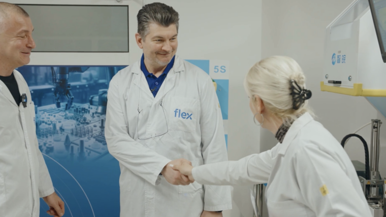 Flex employees shake hands in Romania